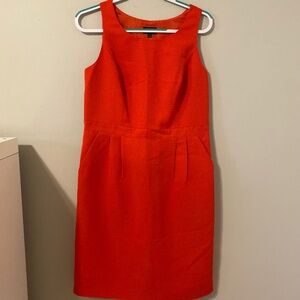 Sleeveless Red orange knee length dress with pockets size 10